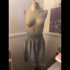 Grey circle skirt with rose detailing on hem